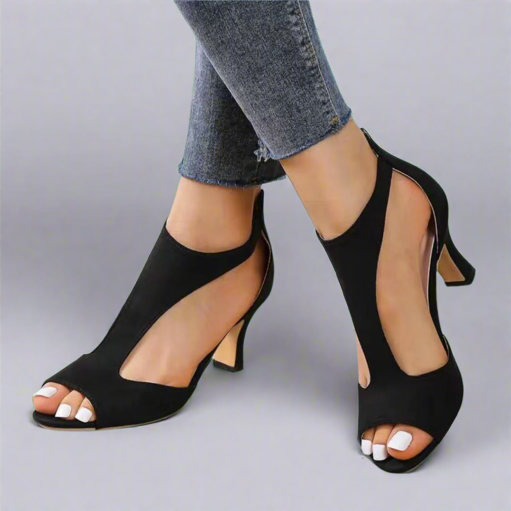 Heel sandal with curved cut