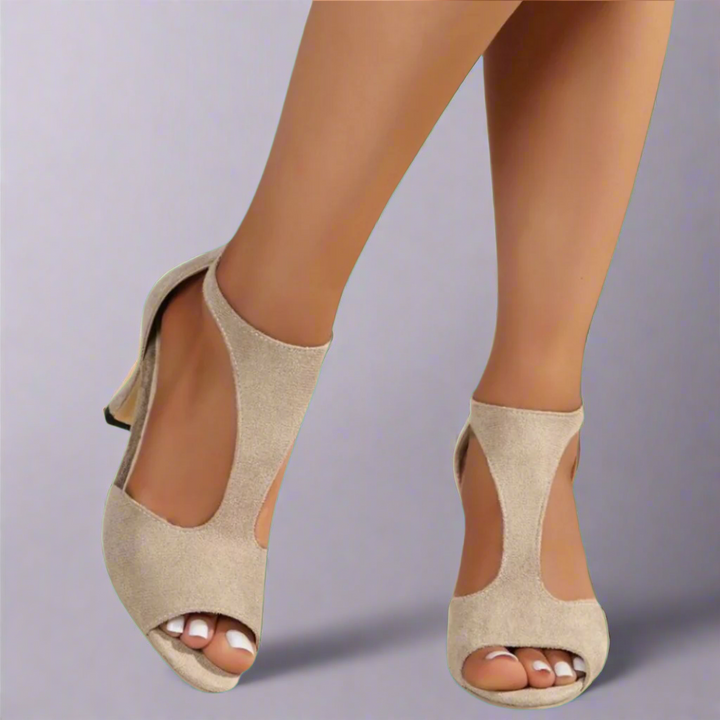 Heel sandal with curved cut