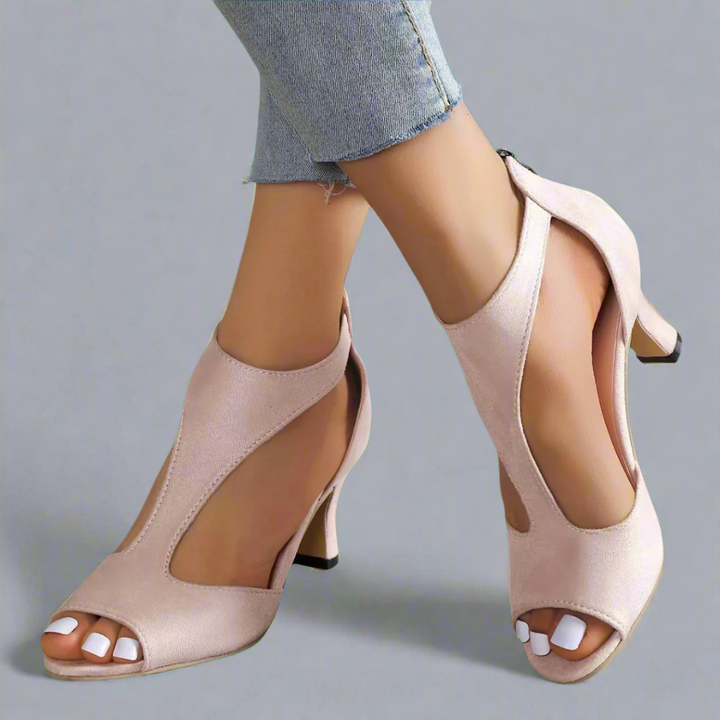 Heel sandal with curved cut